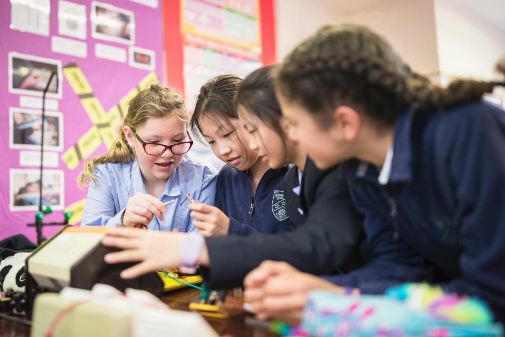 Four pupils undertake a chemistry experiment