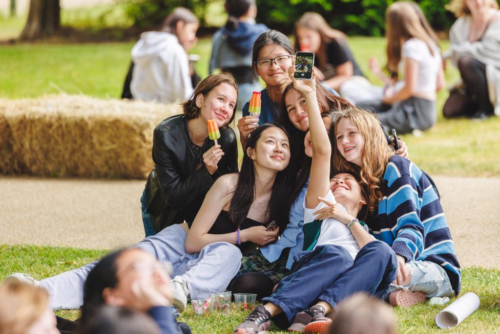 A small group of photos pose for a selfie
